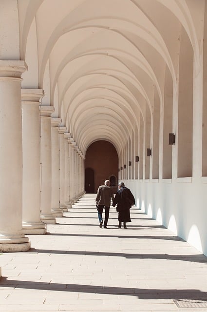 Senior couple reviewing pension investment documents together with confident expressions